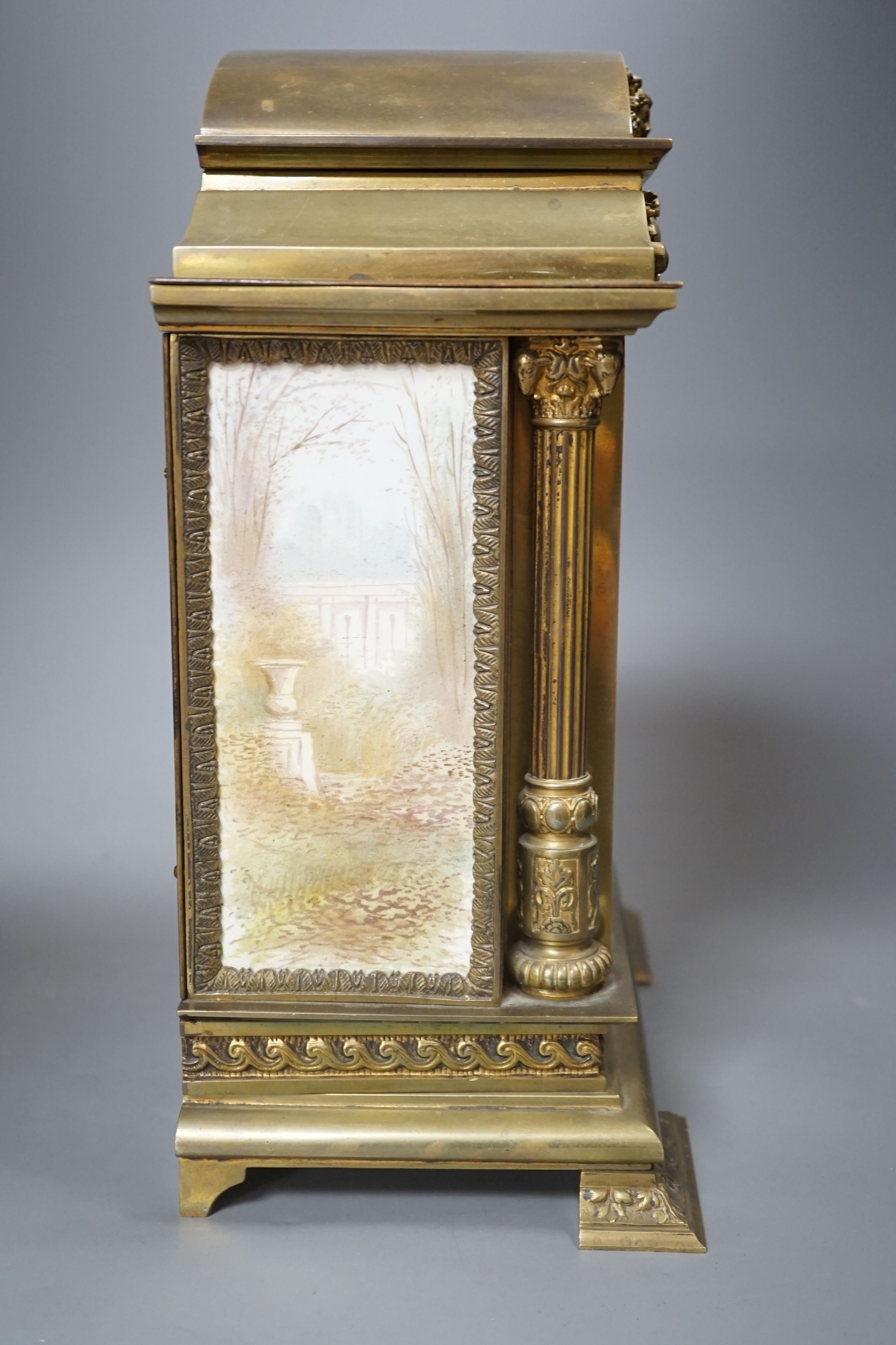 A French porcelain mounted brass mantel clock-31 cms high.